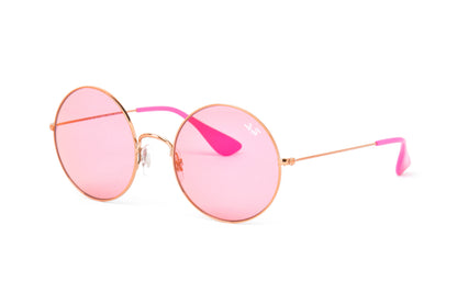 Pink sunglasses with gold frames on a white background
